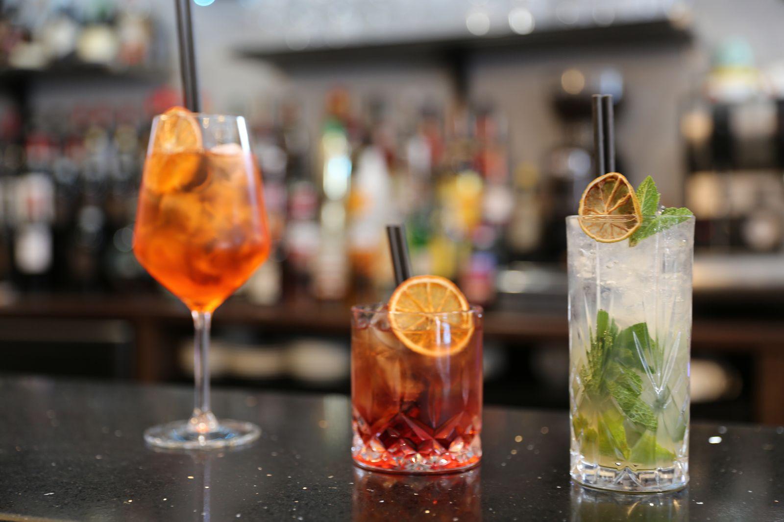 Aperol spritz, negroni and mojito on the bar