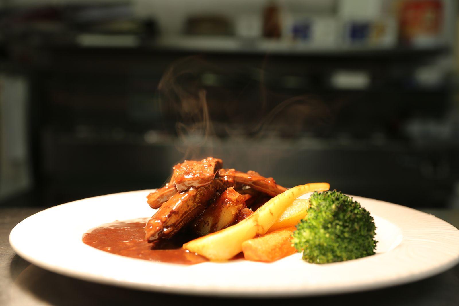 Chicken with chips and broccoli, steaming from the kitchen