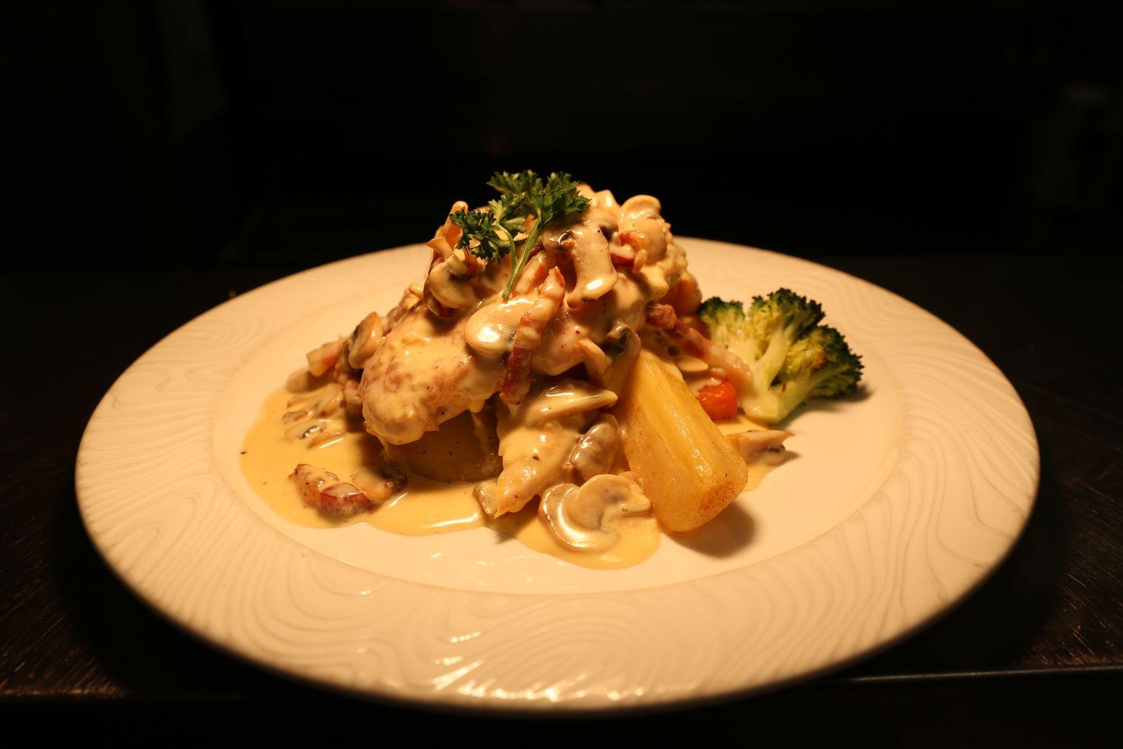 Chicken breast in creamy mushroom sauce with vegetables