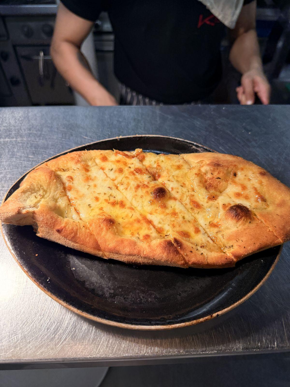 Garlic bread with melted cheese