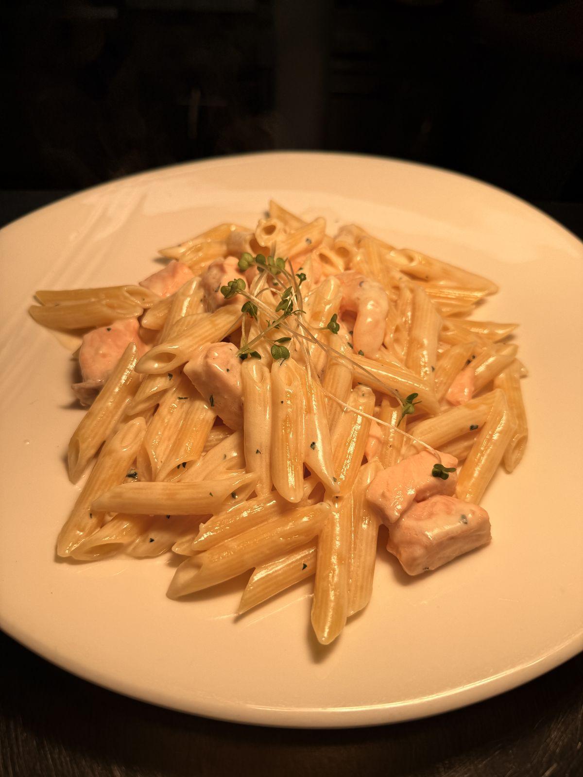 Penne with salmon and prawns in a creamy garlic sauce