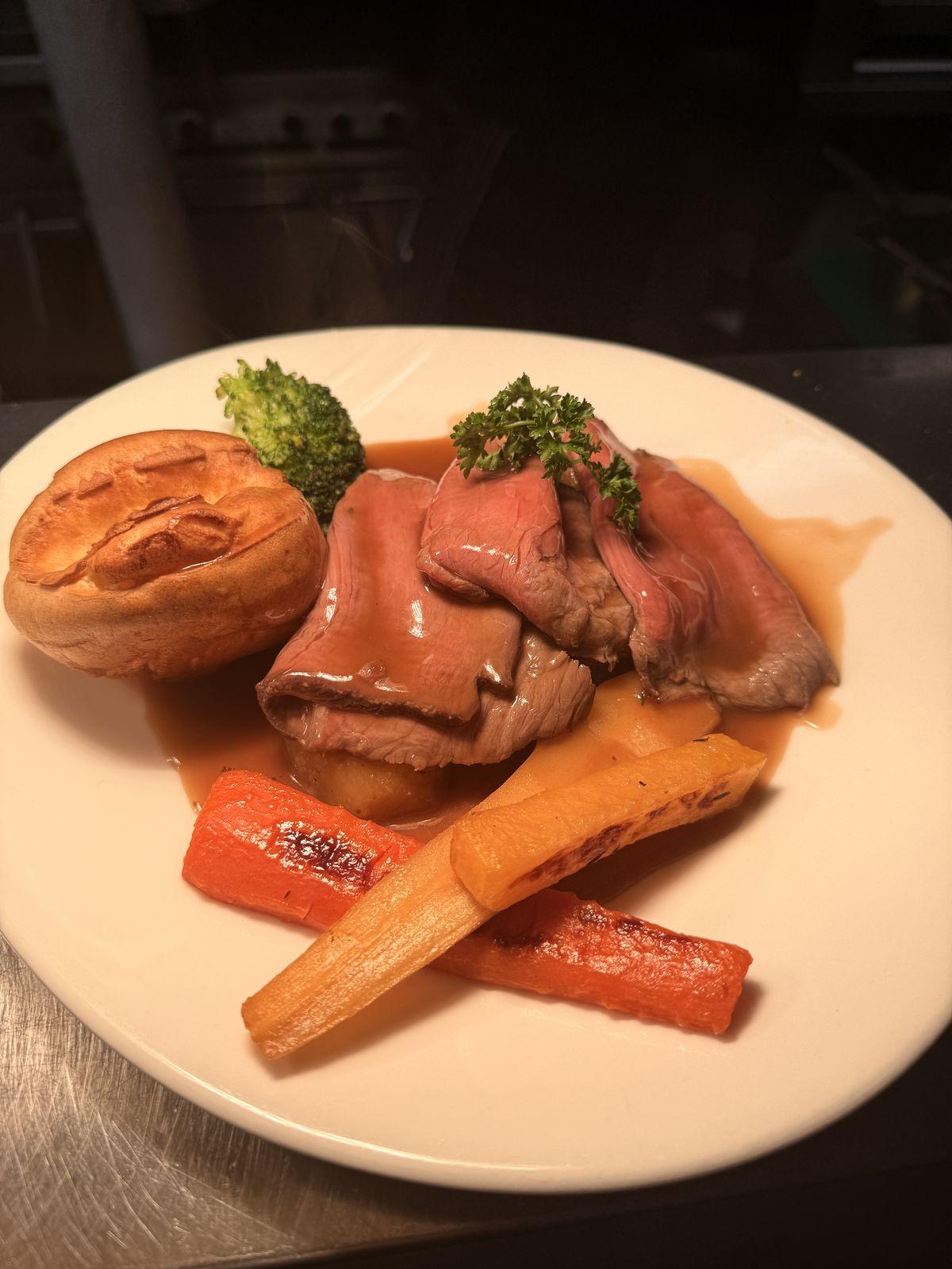 Roast beef with Yorkshire pudding and vegetables