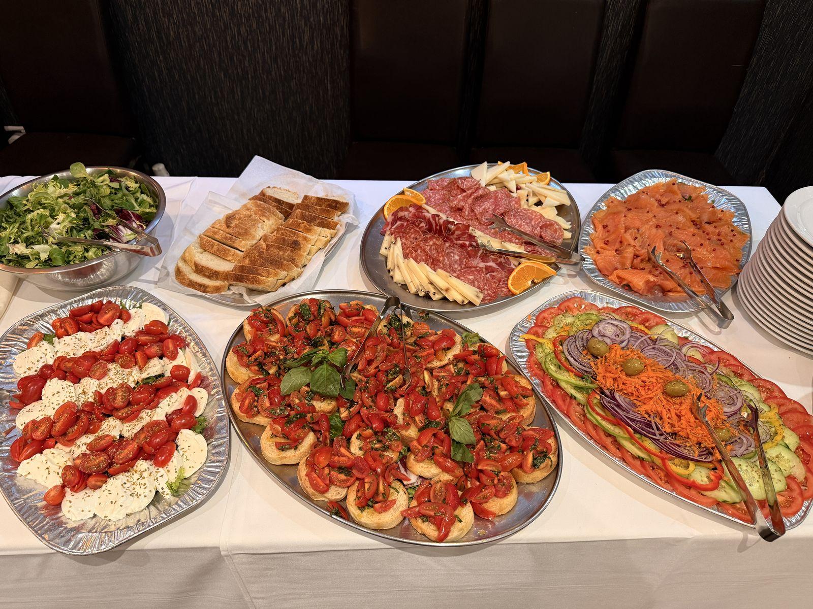A spread of antipasti, salads and bruschetta for a party
