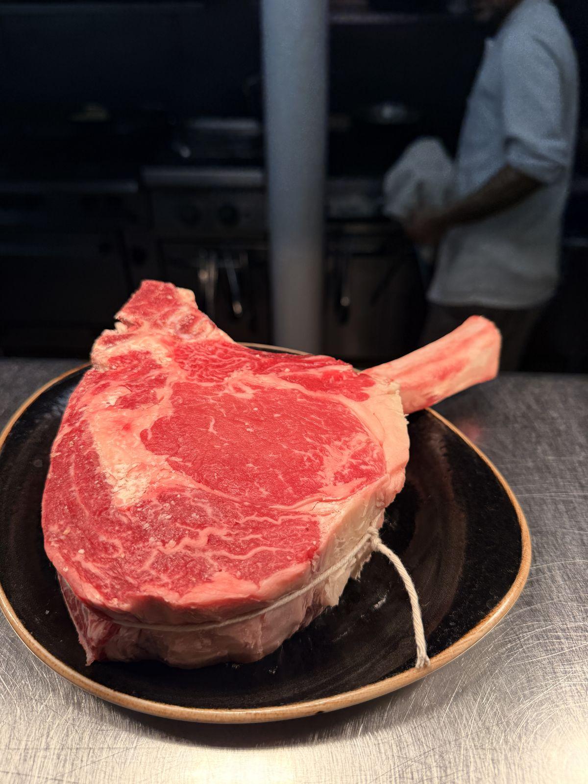 Marbled tomahawk steak before cooking