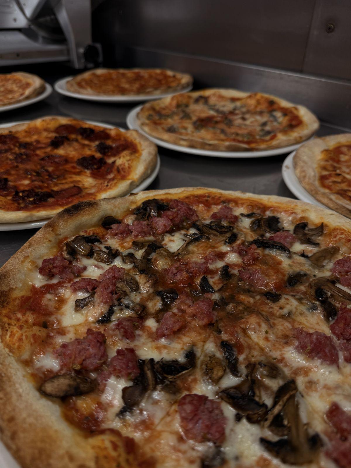 Wood-fired pizza with 'nduja and salami