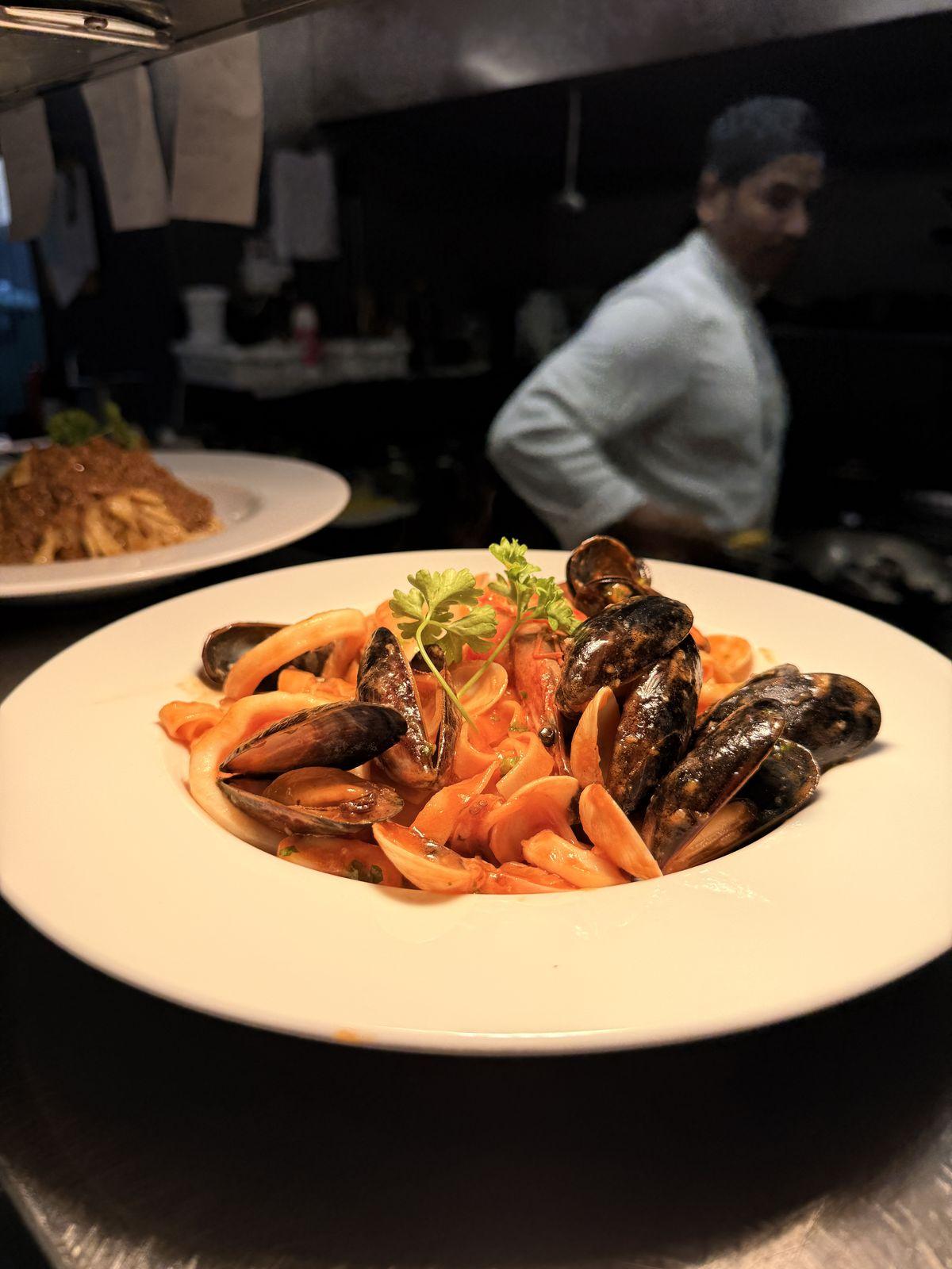 Seafood pasta with mussels in tomato sauce