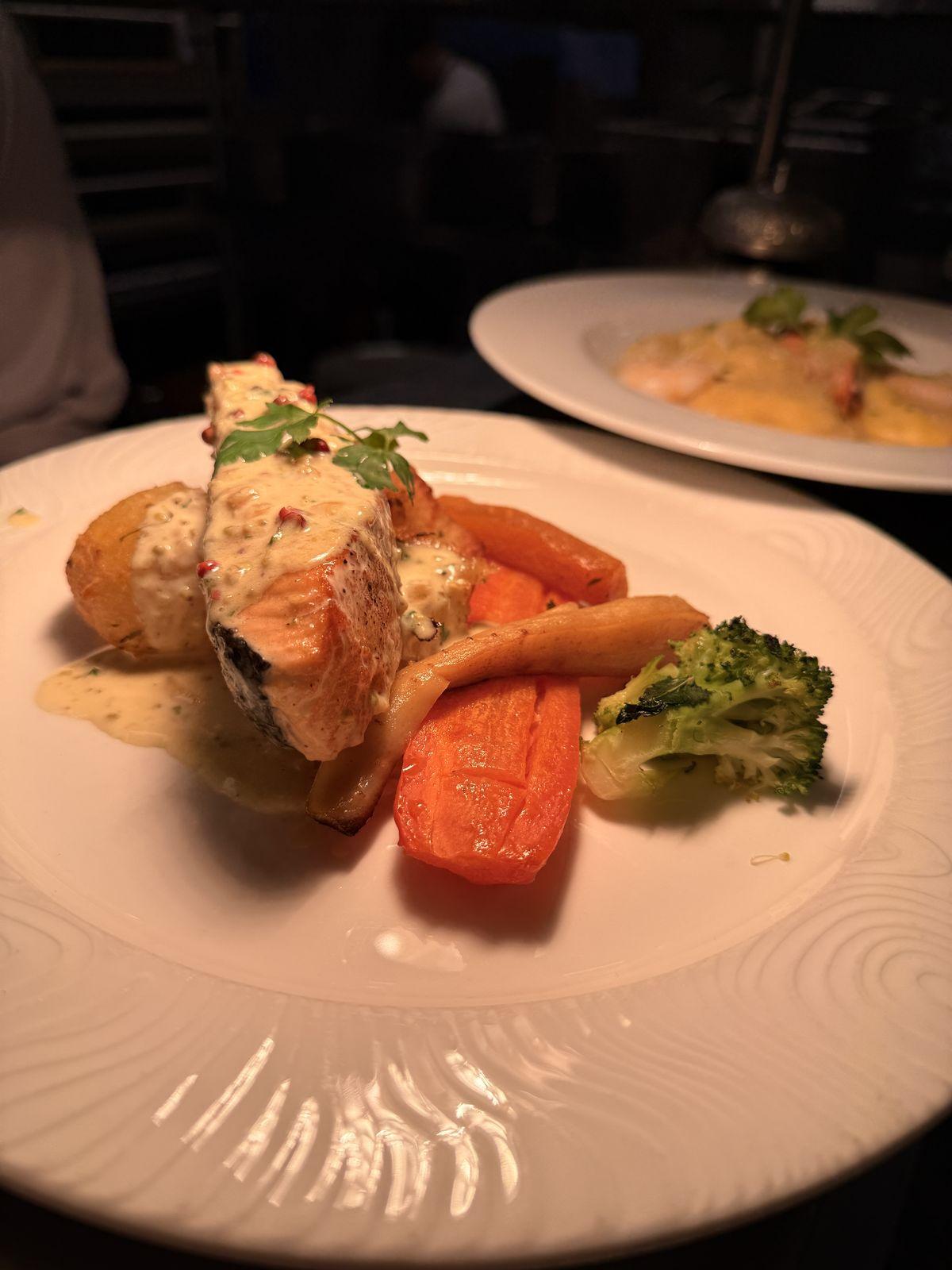 Salmon fillet with pistachio sauce and roasted carrots