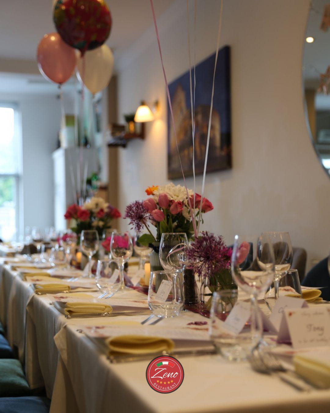 Long table dressed with fresh flowers for a celebration