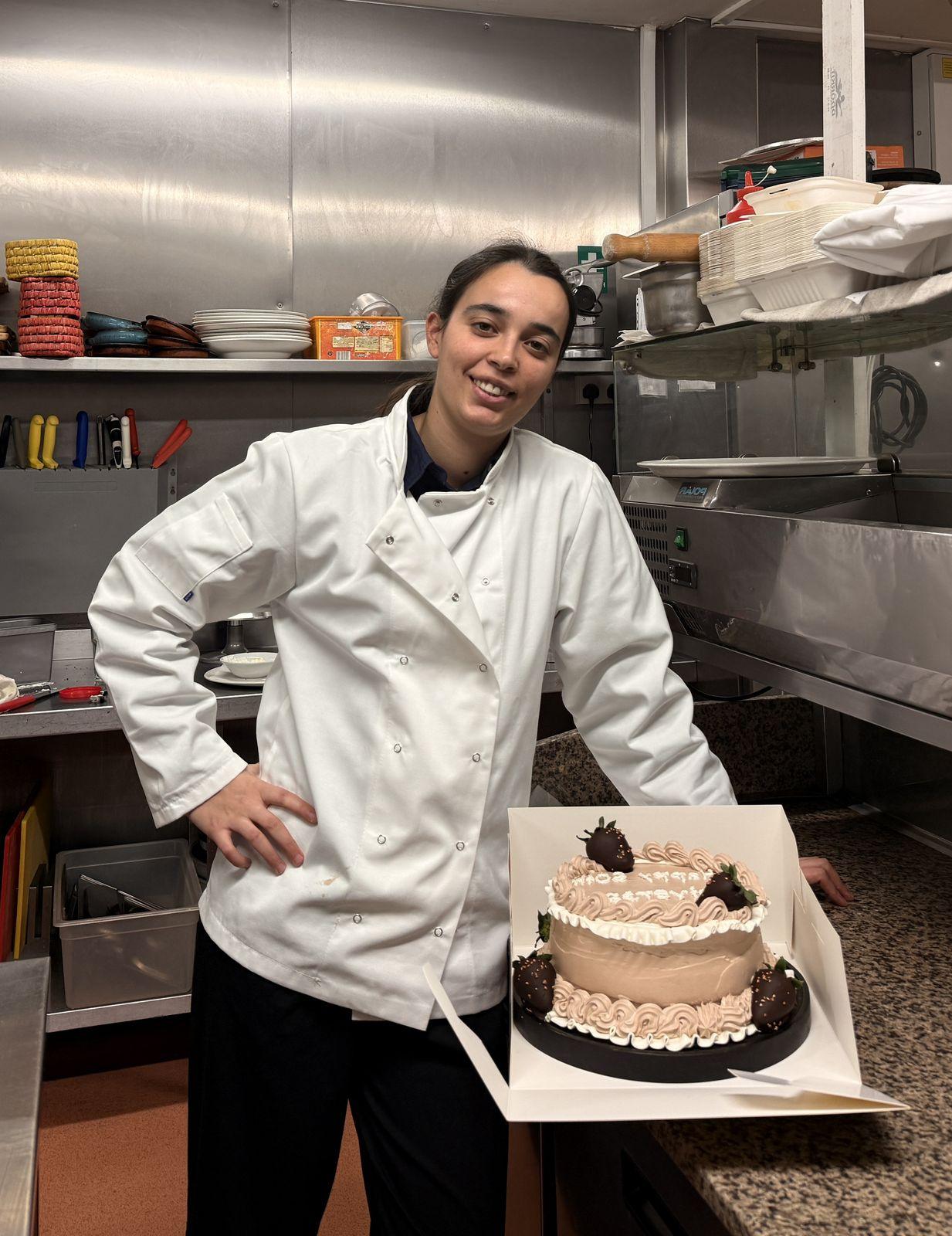 Our chef with a freshly made celebration cake
