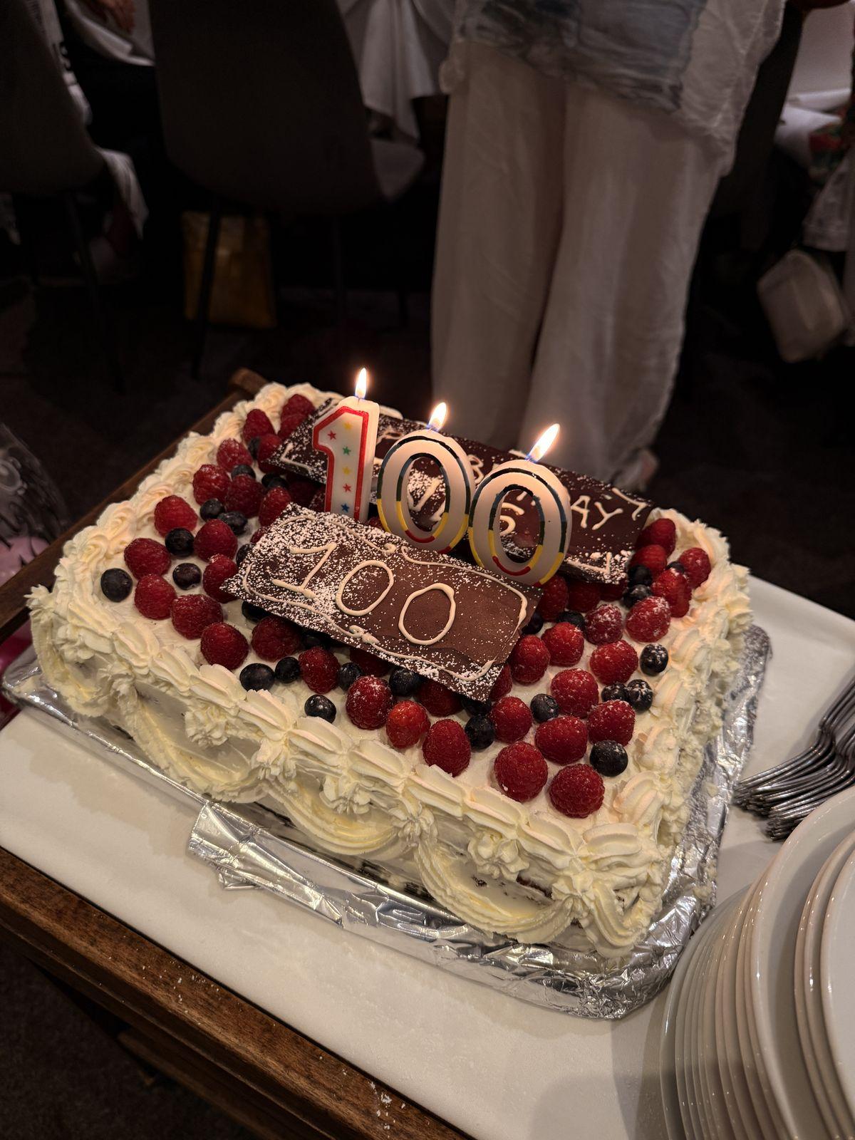 Close-up of the 100th birthday cake with berries